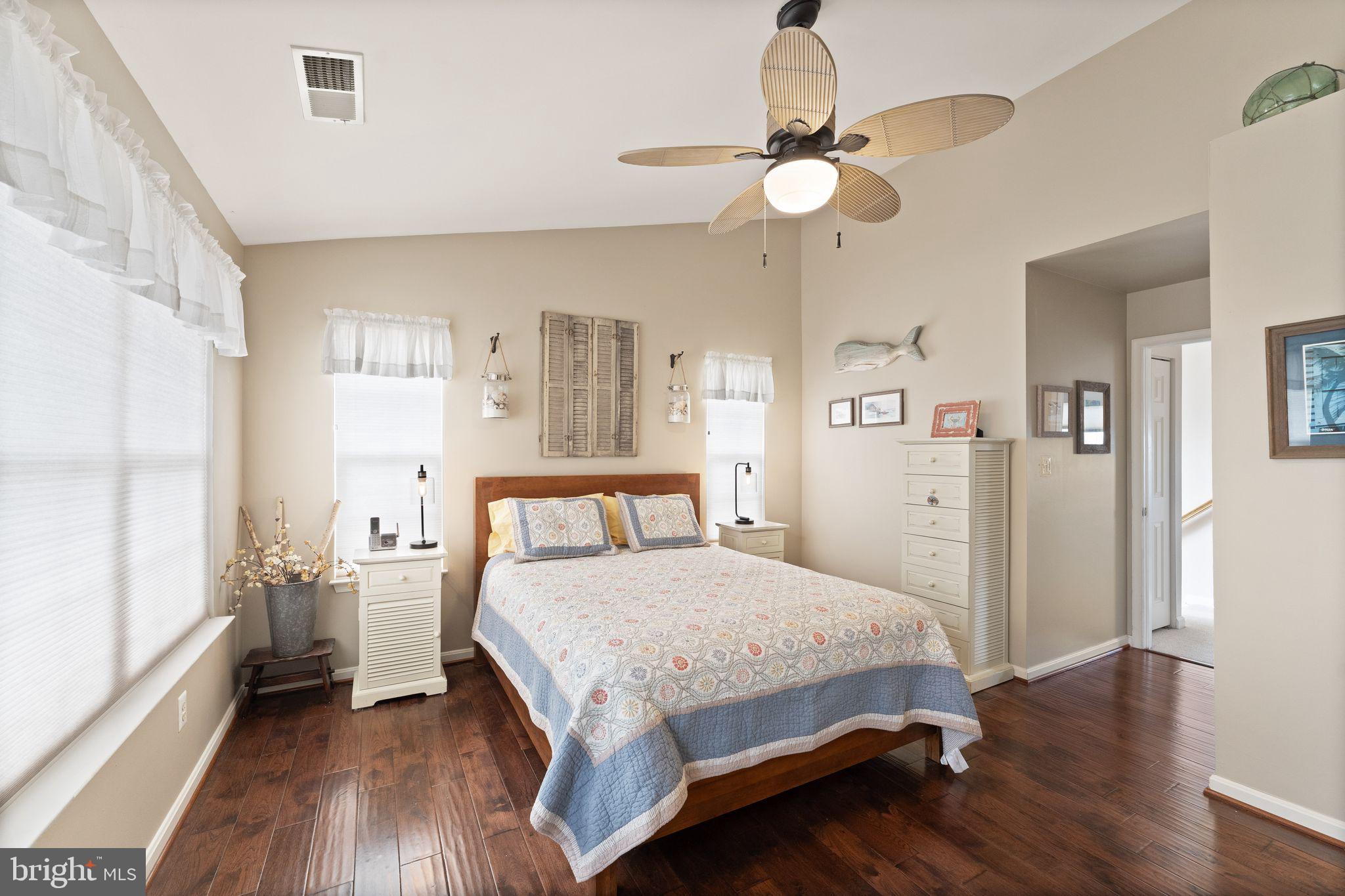 6377 St Timothys Lane Centreville, VA 20121 - Photo 7 of 58 a bedroom with a bed and a chandelier