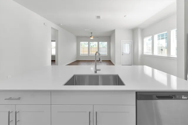 a view of a kitchen from the hallway