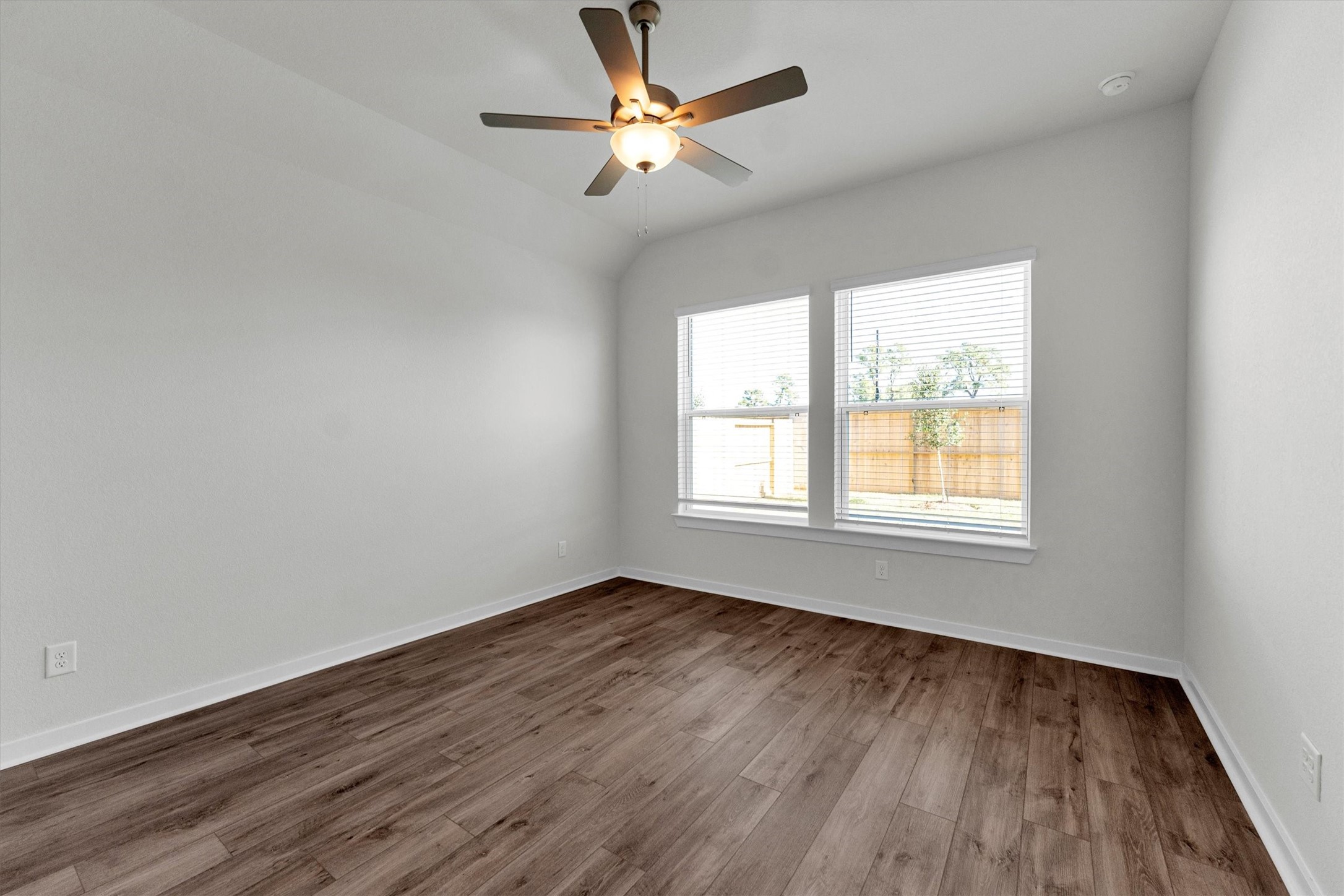 16914 Tulip Row Lane Cypress, TX 77429 - Photo 27 of 48 wooden floor in an empty room with a window
