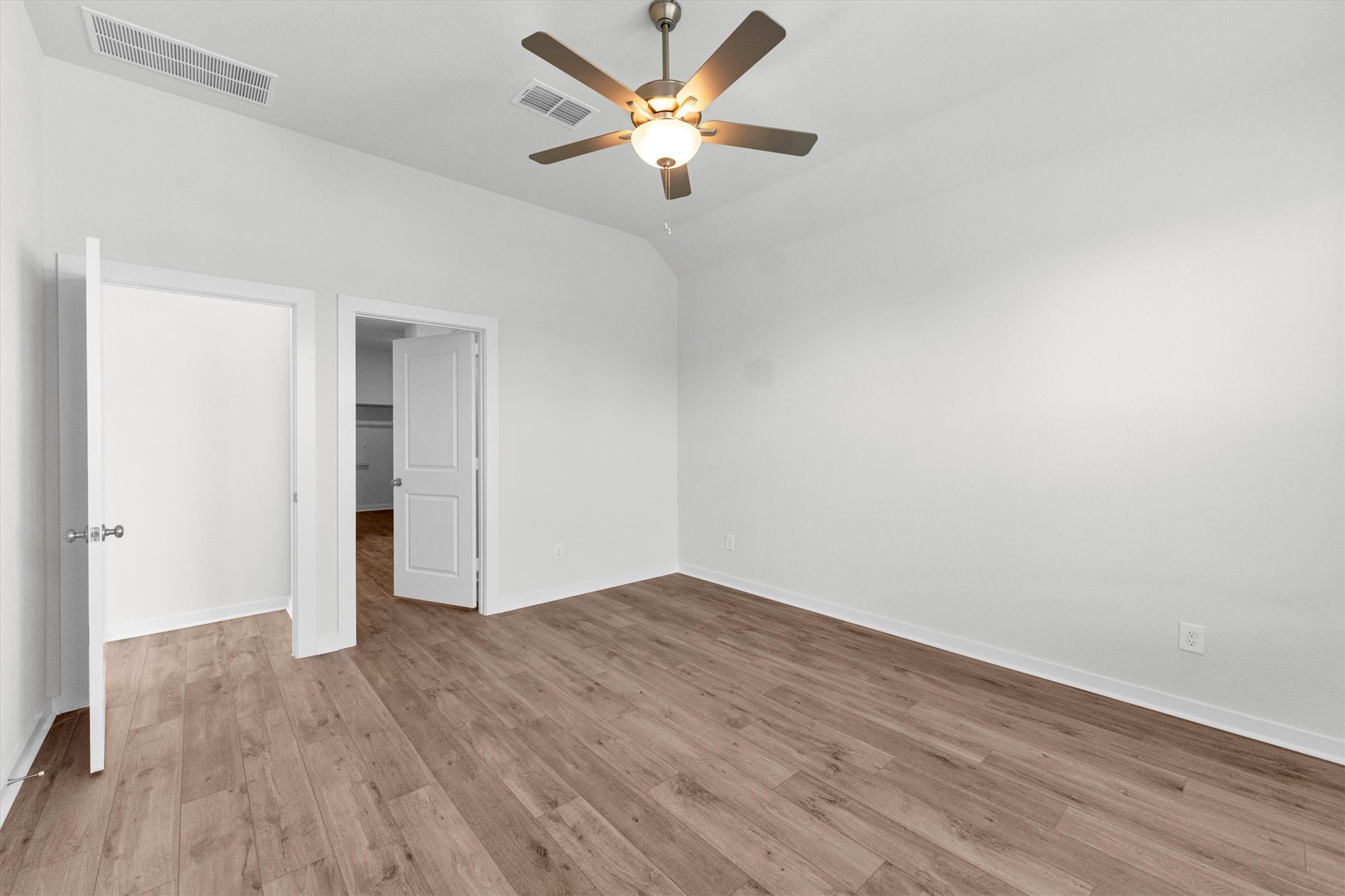 16914 Tulip Row Lane Cypress, TX 77429 - Photo 29 of 48 an empty room with wooden floor and a ceiling fan