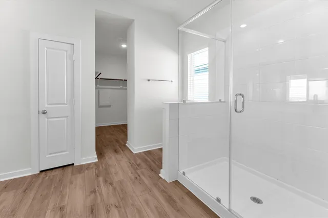 a bathroom with a double vanity sink and mirror