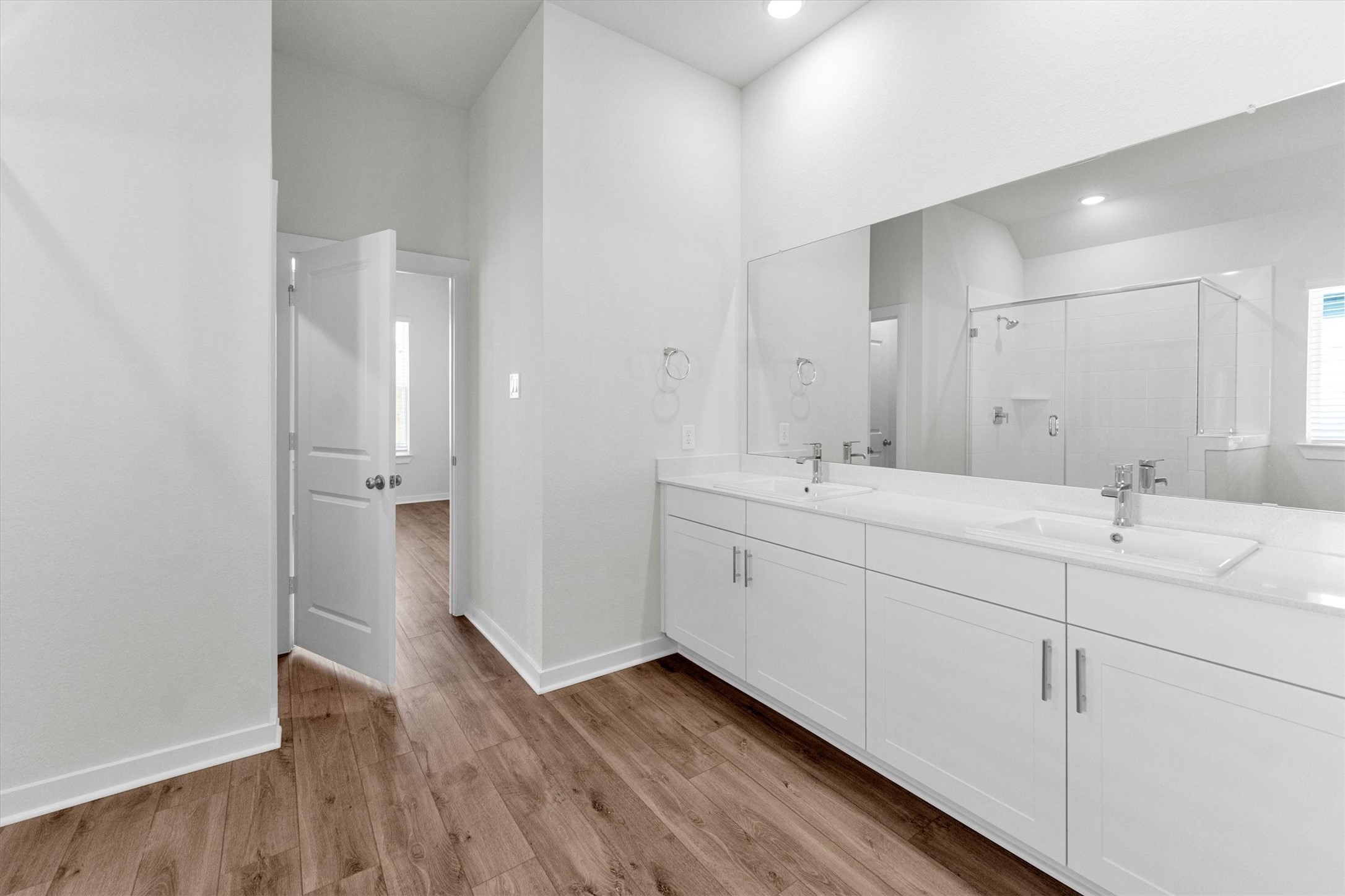 16914 Tulip Row Lane Cypress, TX 77429 - Photo 35 of 48 a spacious bathroom with a double vanity sink a mirror and a shower