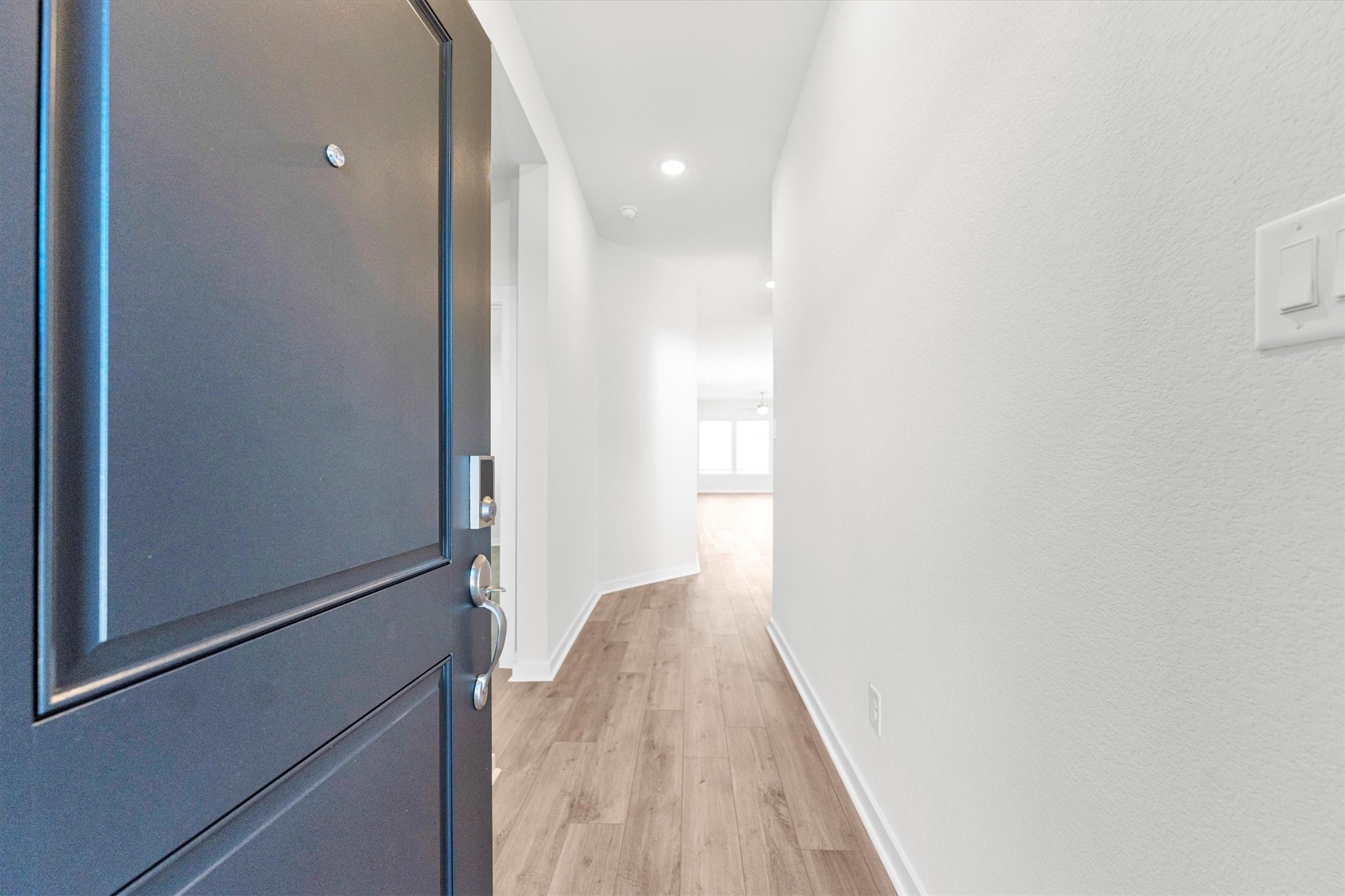 16914 Tulip Row Lane Cypress, TX 77429 - Photo 39 of 48 a view of a hallway with wooden floor
