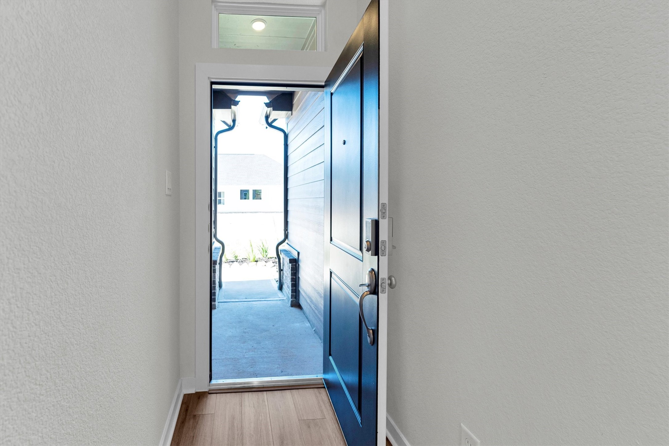 16914 Tulip Row Lane Cypress, TX 77429 - Photo 40 of 48 a view of a hallway with wooden floor and a livingroom