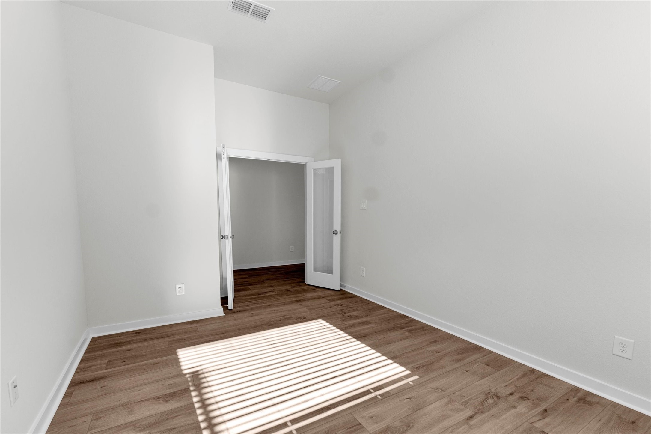 16914 Tulip Row Lane Cypress, TX 77429 - Photo 47 of 48 a view of a room with wooden floor and white wall