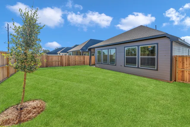a view of a house with backyard porch and garden