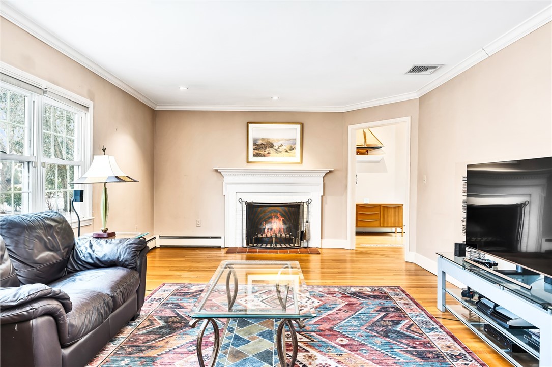 30 Adams Point Road Barrington, RI 02806 - Photo 9 of 25 large living room with fireplace and great natural light