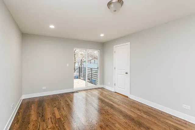 a kitchen with a sink a microwave a refrigerator and cabinets