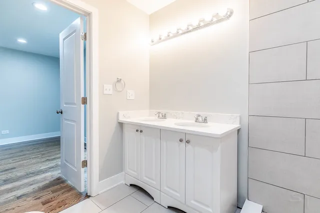 a kitchen with stainless steel appliances a stove microwave and sink