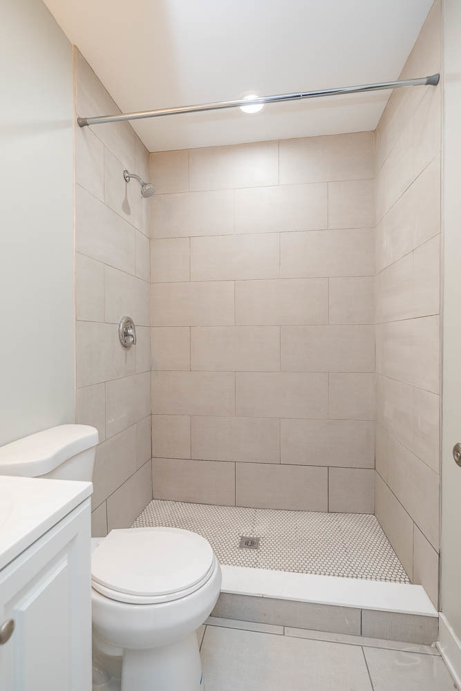 2109 West 18th Place Chicago, IL 60608 - Photo 56 of 63 a bathroom with a shower and a toilet