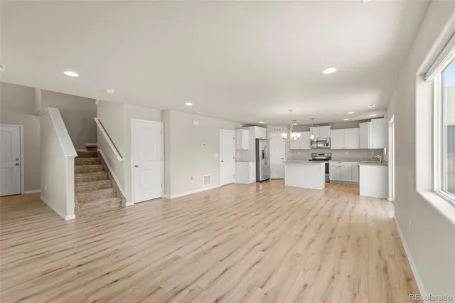 a view of kitchen with wooden floor
