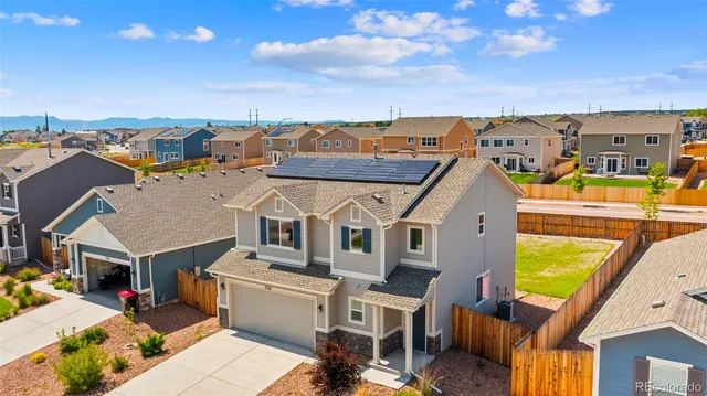 an aerial view of a house with a garden