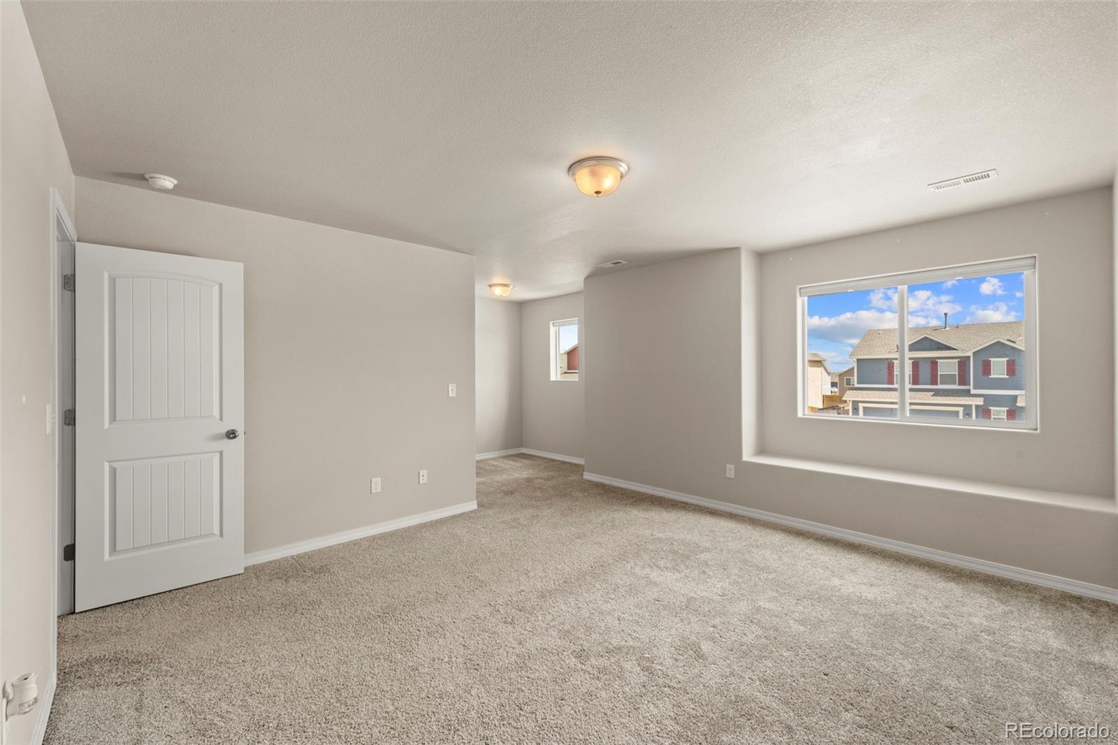 7721 Berwyn Loop Peyton, CO 80831 - Photo 27 of 35 a view of an empty room with window