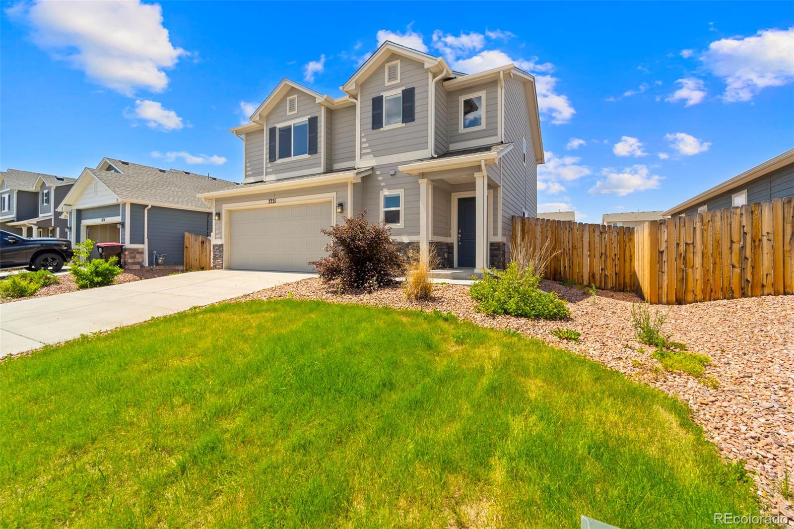 7721 Berwyn Loop Peyton, CO 80831 - Photo 31 of 35 a front view of a house with a yard