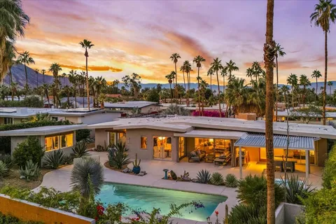 a view of a patio with couches chairs and a table