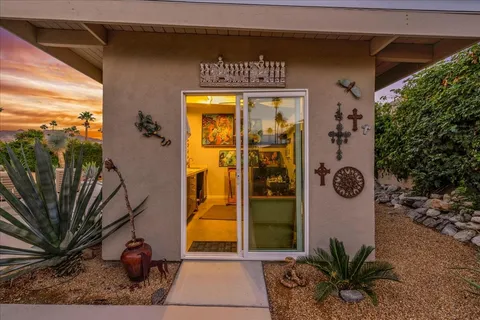 a bedroom with a bed couch and window