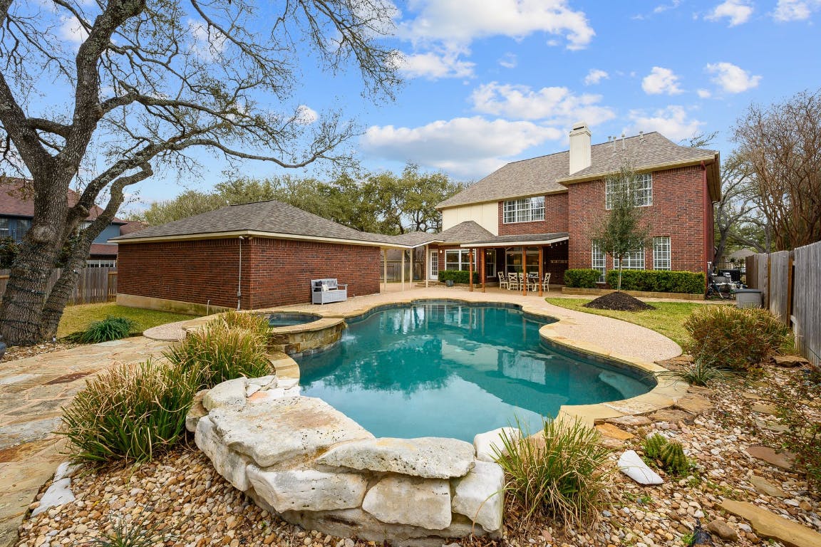 5823 Van Winkle Lane Austin, TX 78739 - Photo 1 of 1 a view of a house with swimming pool and a sitting area