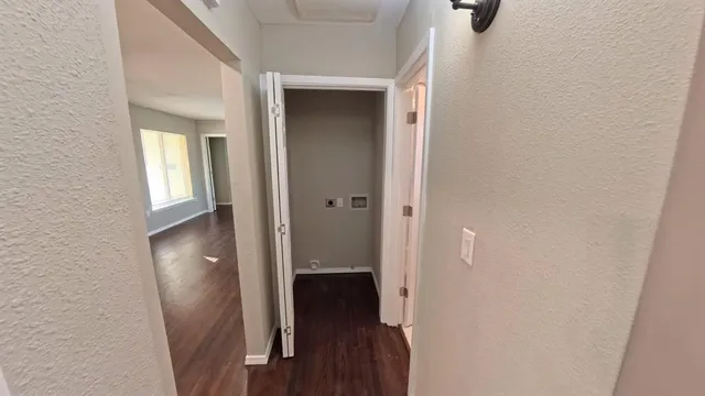 a view of a bathroom from a hallway