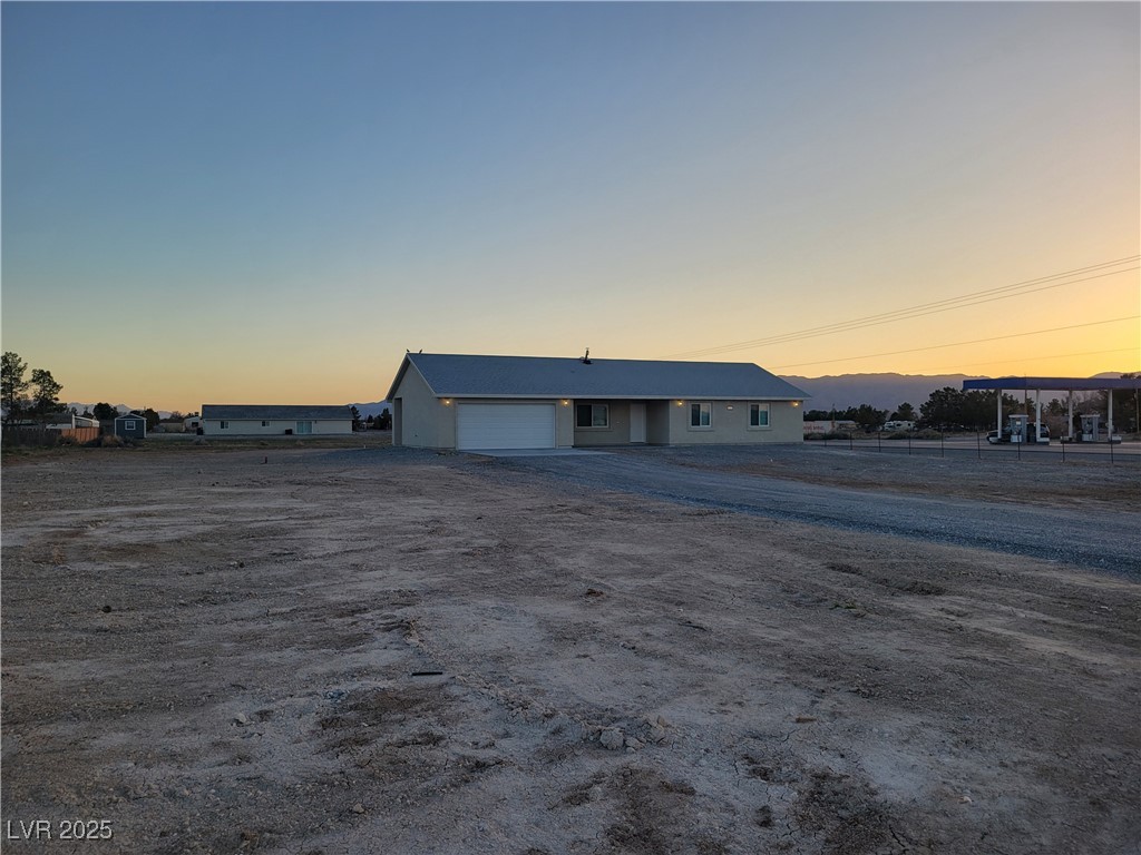 1021 East Manse Road Pahrump, NV 89048 - Photo 1 of 25 View of front of property with driveway
