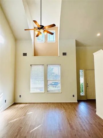 a view of a living room with a wooden floor