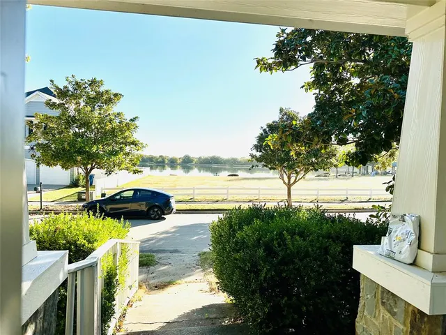 a view of swimming pool with outdoor seating and plants