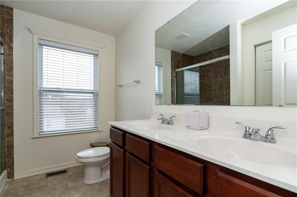 100 Willow Drive Natrona Heights, PA 15065 - Photo 18 of 20 a bathroom with a sink and a mirror