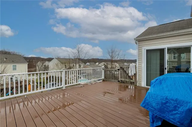 a view of a balcony with wooden floor