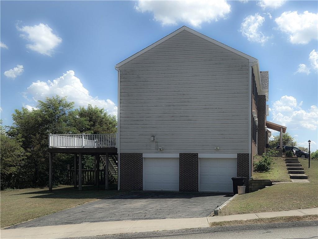 100 Willow Drive Natrona Heights, PA 15065 - Photo 2 of 20 a front view of a house with a yard