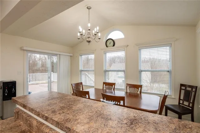 a view of a livingroom with furniture window and wooden floor