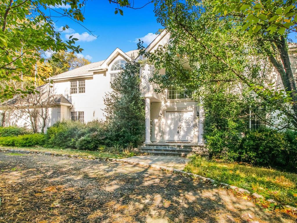 6 Puritan Road Rye, NY 10580 - Photo 1 of 1 a front view of a house with a yard
