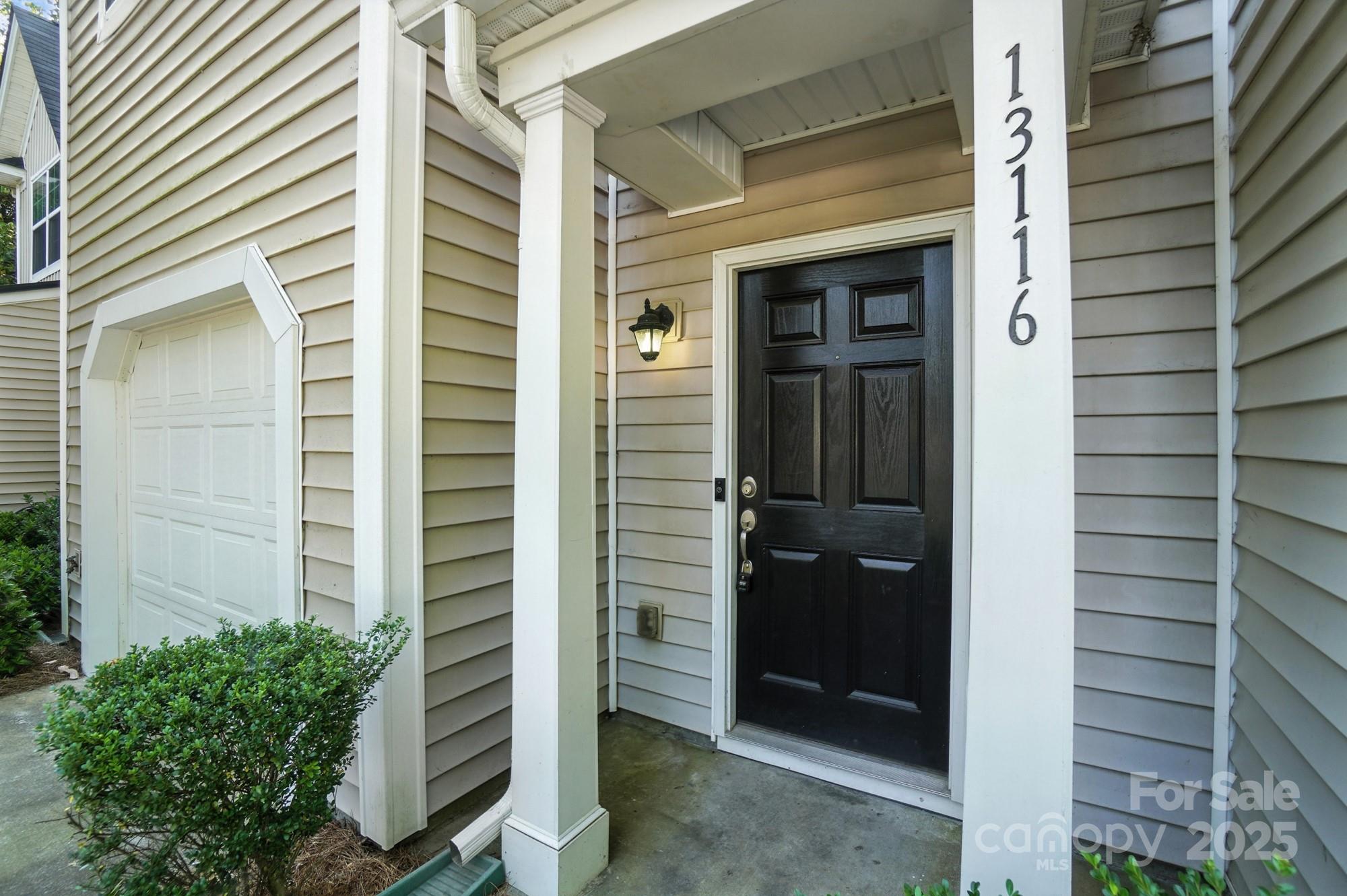 13116 Erwin Road Charlotte, NC 28273 - Photo 2 of 27 a view of front door and potted plant