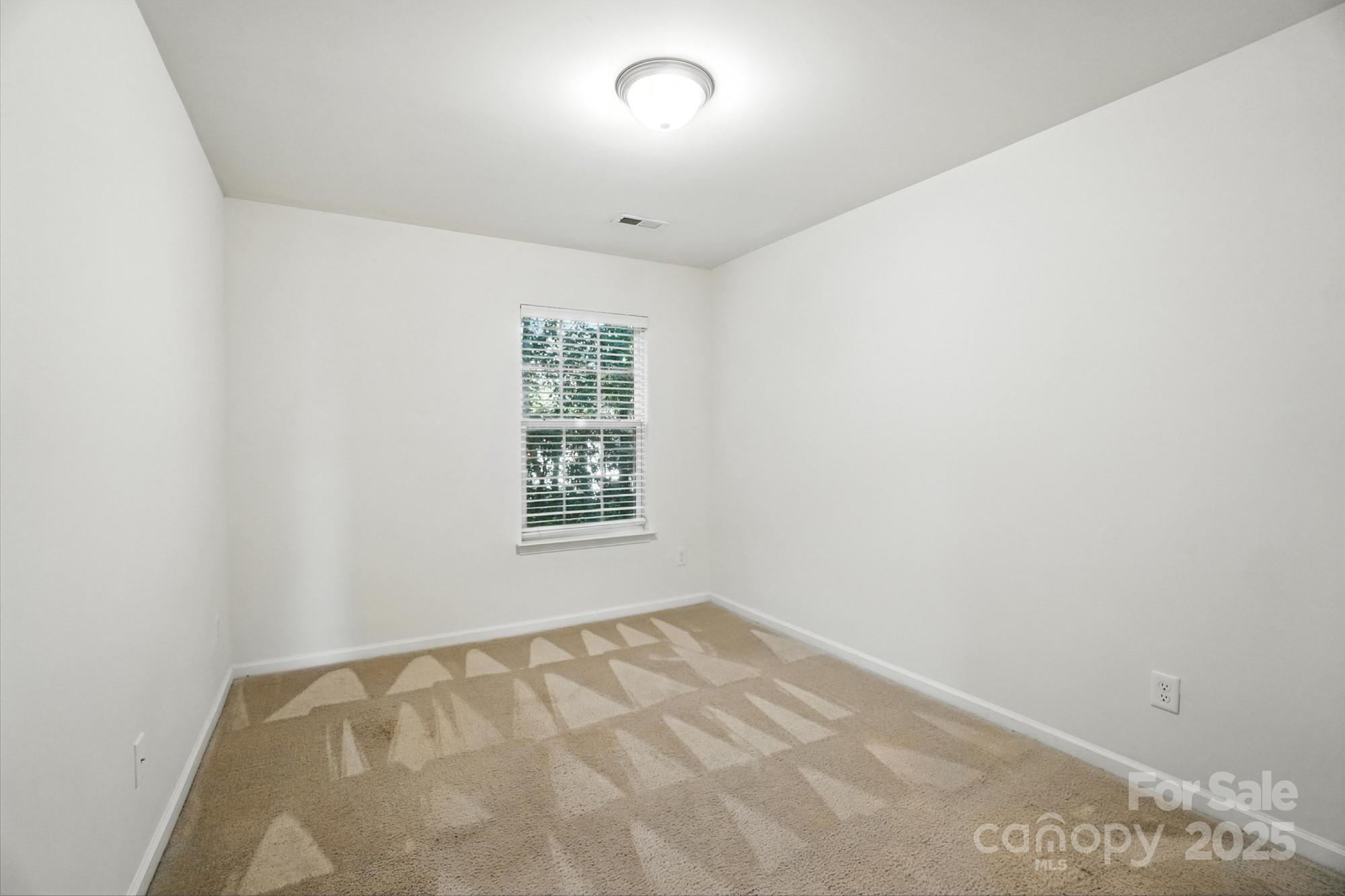 13116 Erwin Road Charlotte, NC 28273 - Photo 22 of 27 an empty room with a window