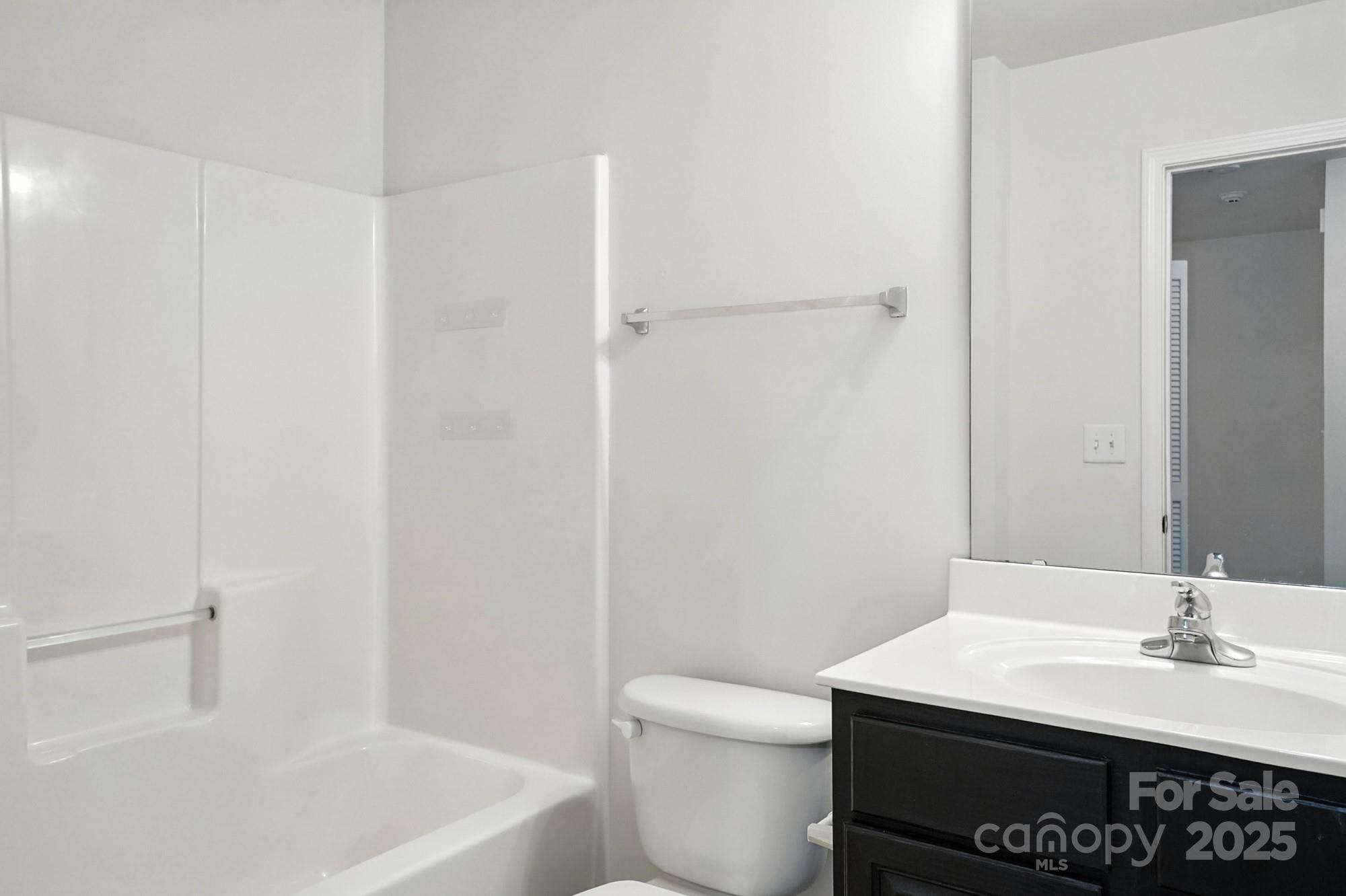 13116 Erwin Road Charlotte, NC 28273 - Photo 24 of 27 a bathroom with a sink a toilet and shower