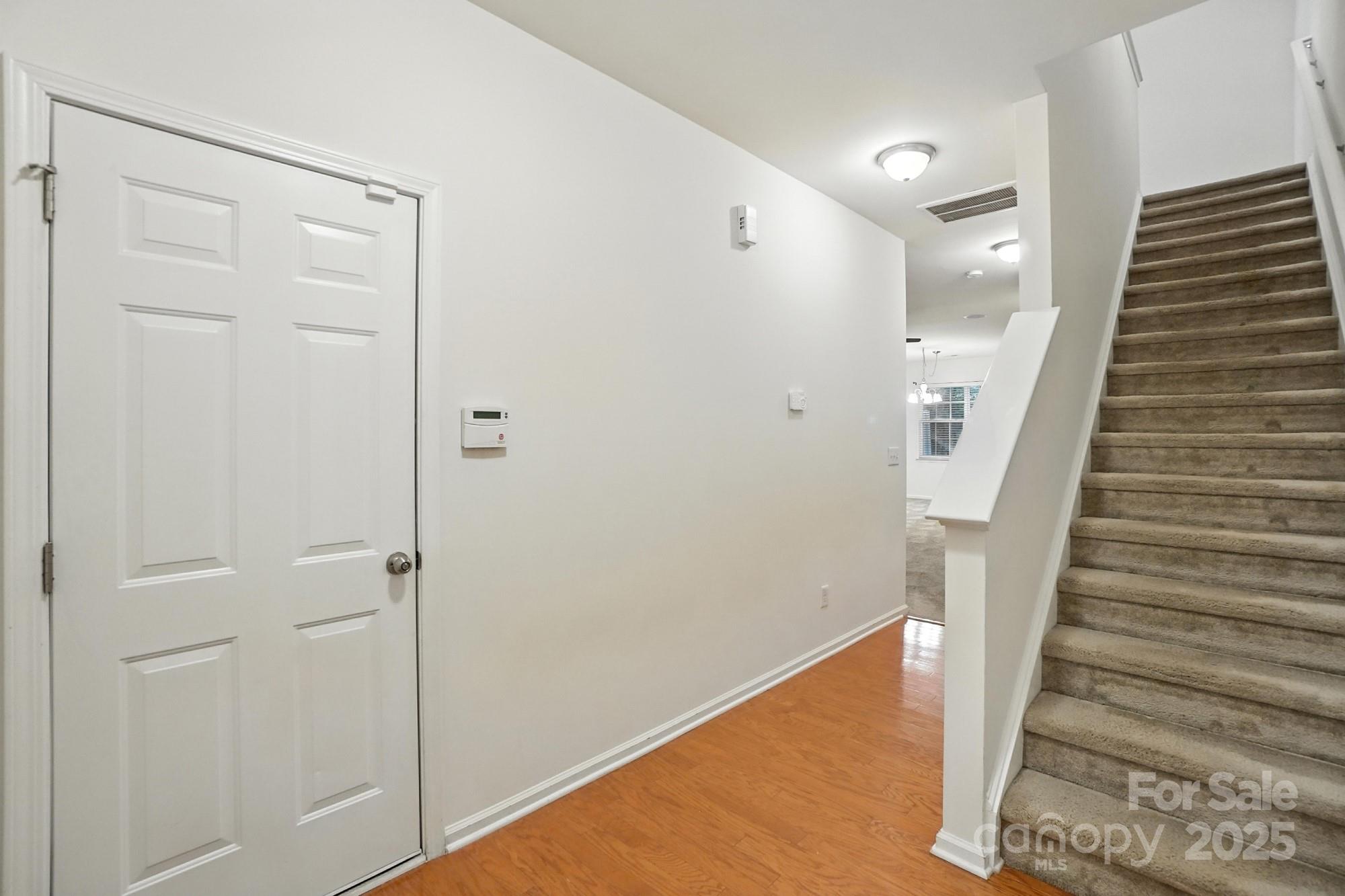 13116 Erwin Road Charlotte, NC 28273 - Photo 4 of 27 a view of entryway with wooden floor