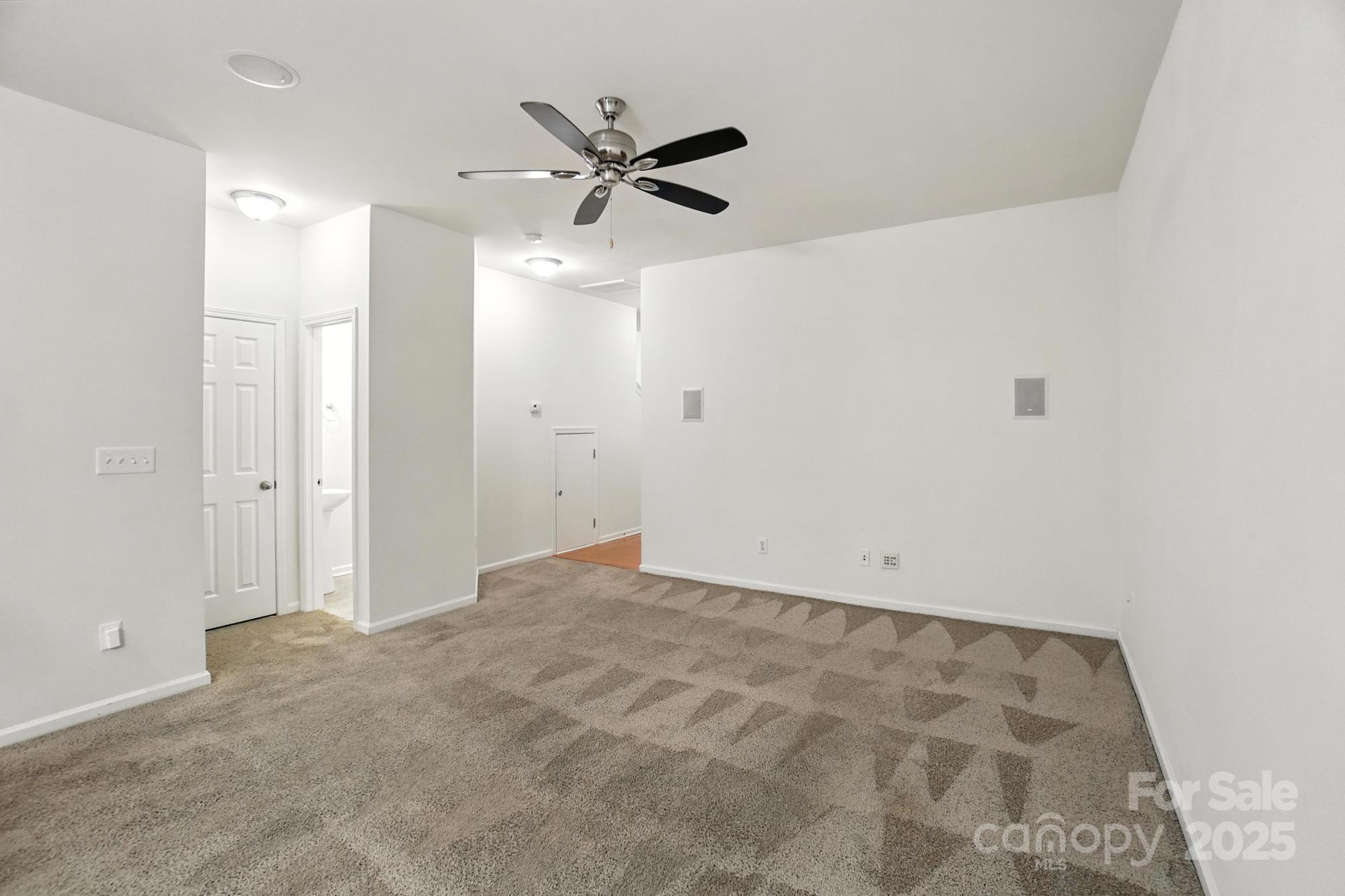 13116 Erwin Road Charlotte, NC 28273 - Photo 6 of 27 a view of a big room with wooden floor and windows
