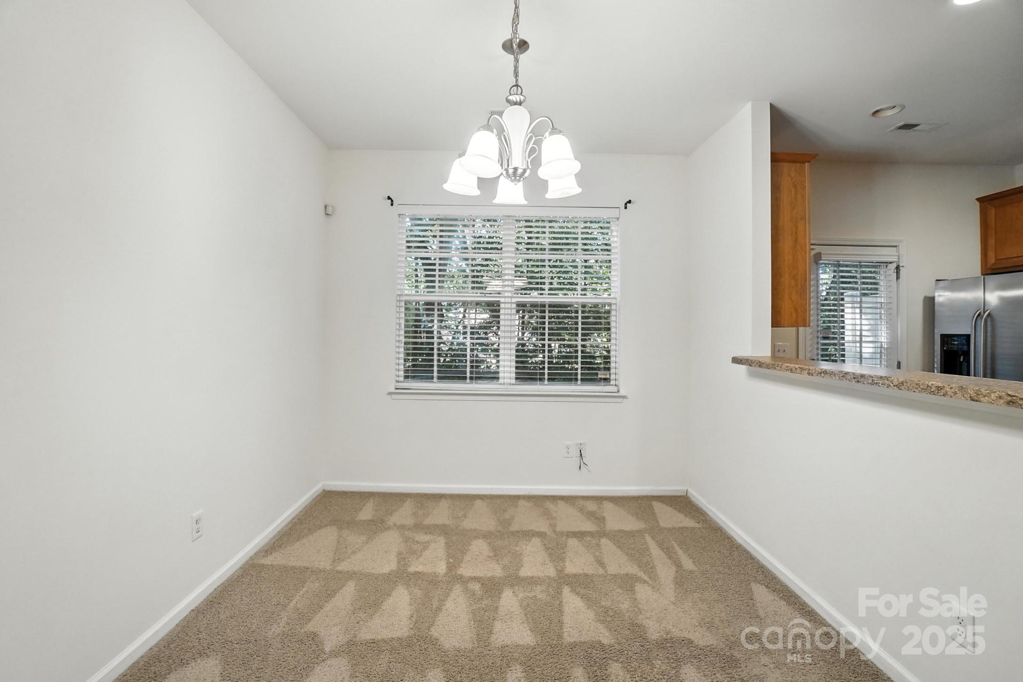 13116 Erwin Road Charlotte, NC 28273 - Photo 8 of 27 a view of an empty room with a window