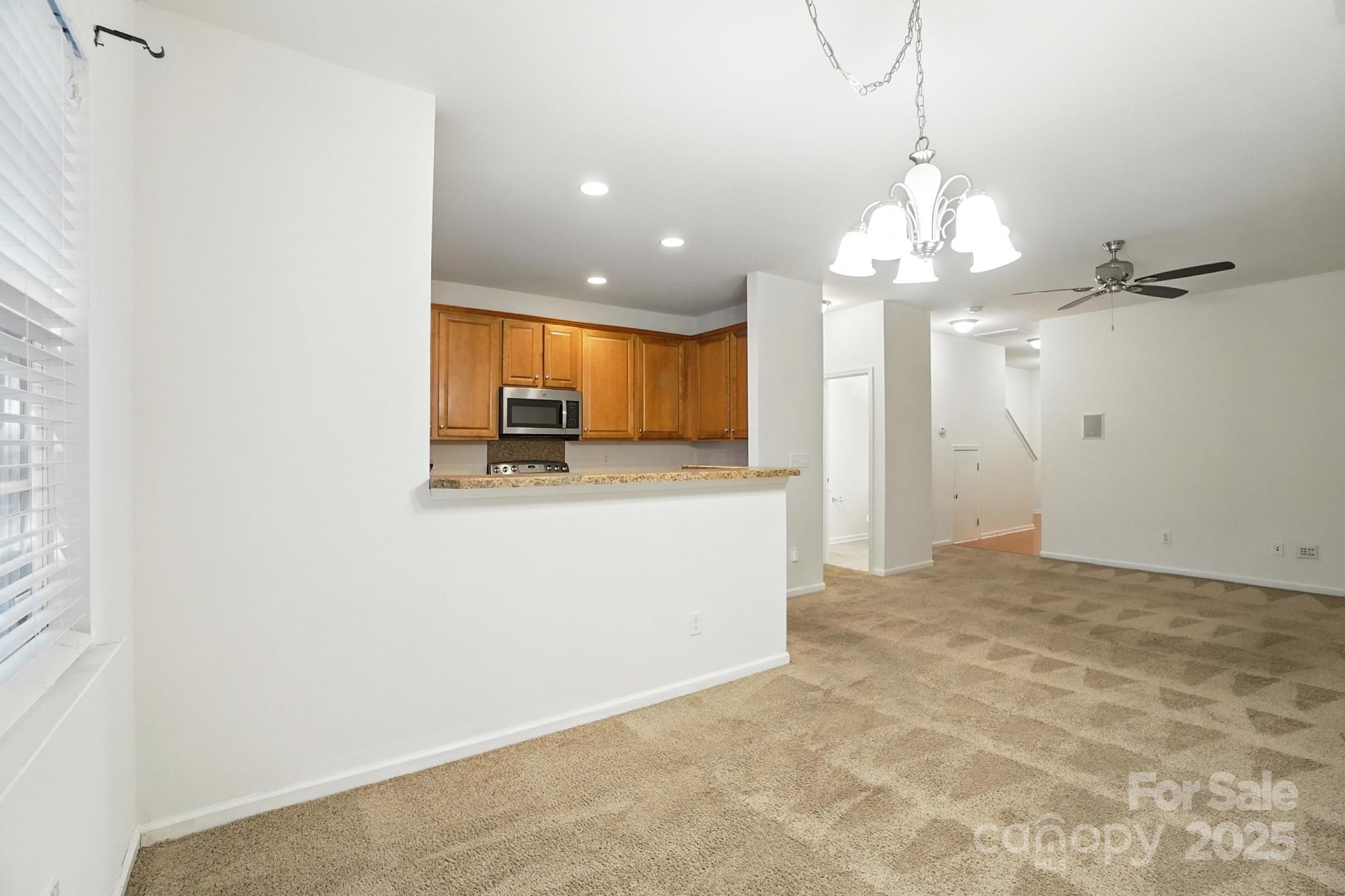 13116 Erwin Road Charlotte, NC 28273 - Photo 9 of 27 a view of a kitchen with a sink and cabinet area