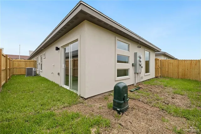 a backyard of a house with barbeque oven