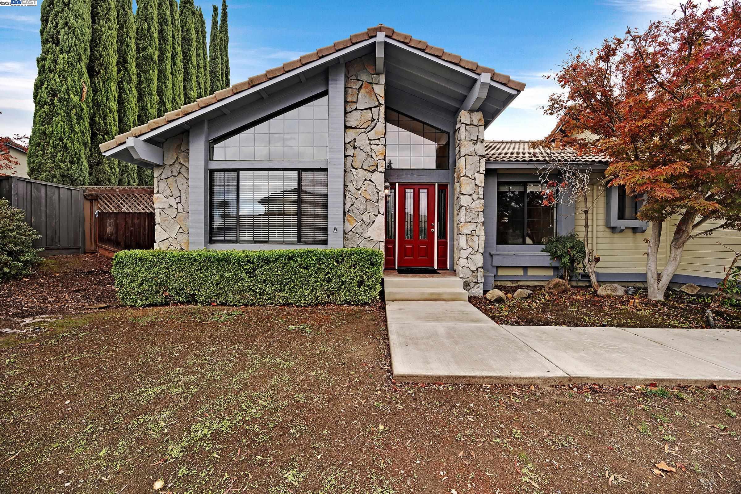 a front view of a house with garden