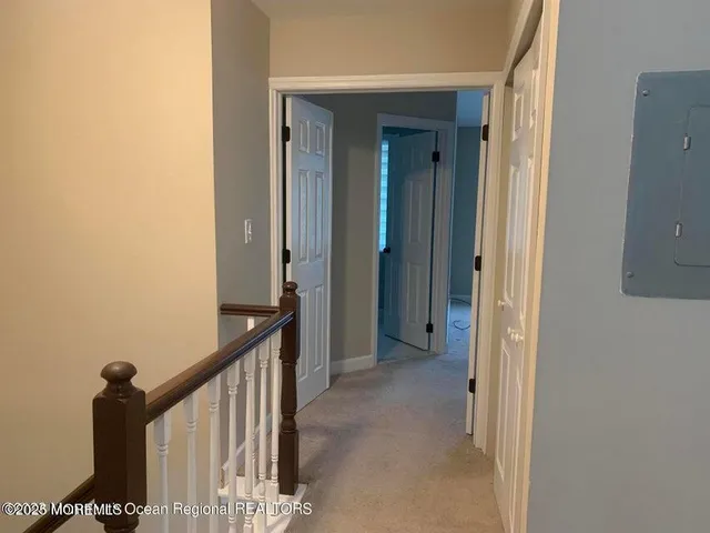 a view of a hallway with a closet