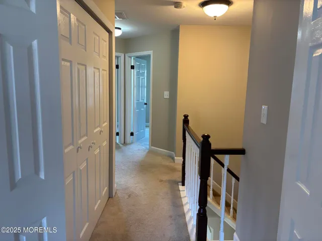 a view of a hallway and closet
