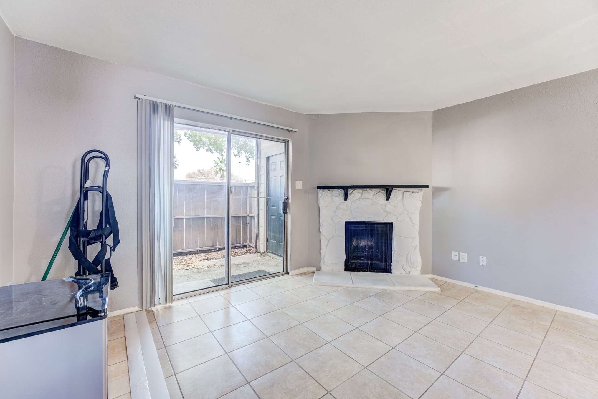 6001 Reims Road, Unit 1101 Houston, TX 77036 - Photo 11 of 35 a view of a livingroom with a fireplace and window