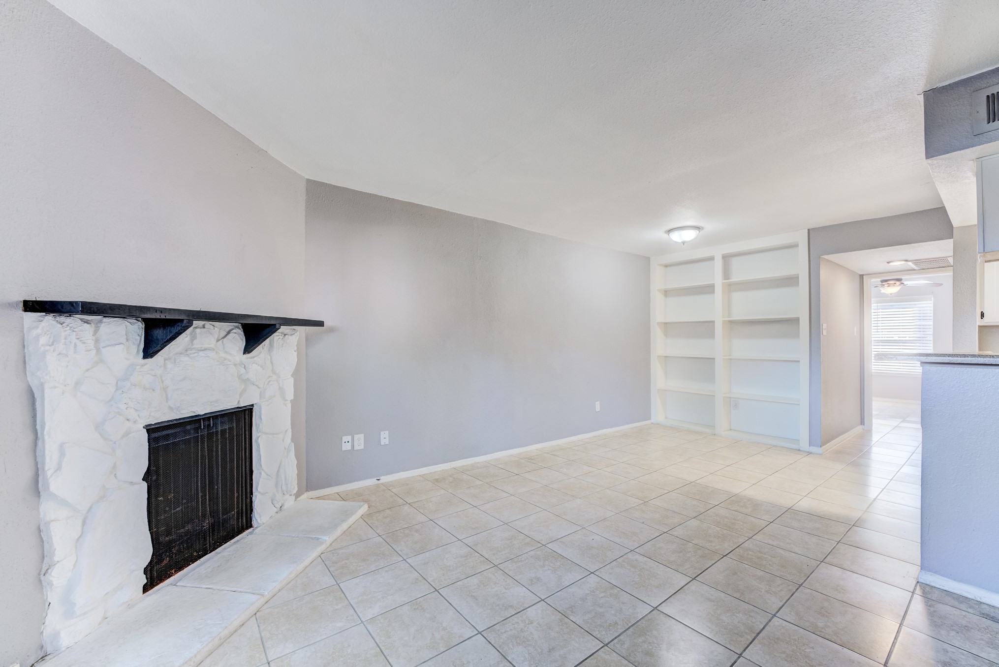6001 Reims Road, Unit 1101 Houston, TX 77036 - Photo 15 of 35 a view of a livingroom with a fireplace