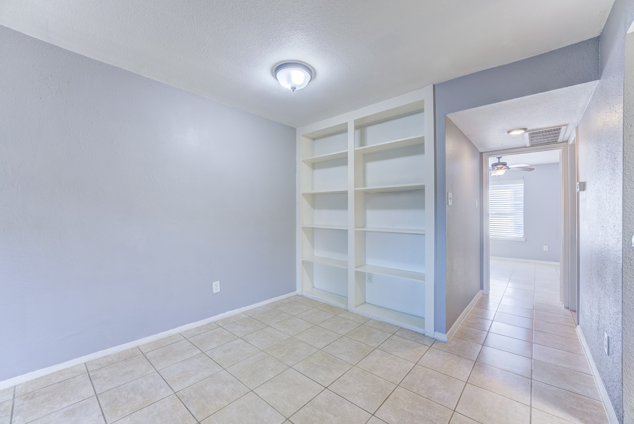 6001 Reims Road, Unit 1101 Houston, TX 77036 - Photo 18 of 35 a view of an empty room and closet area