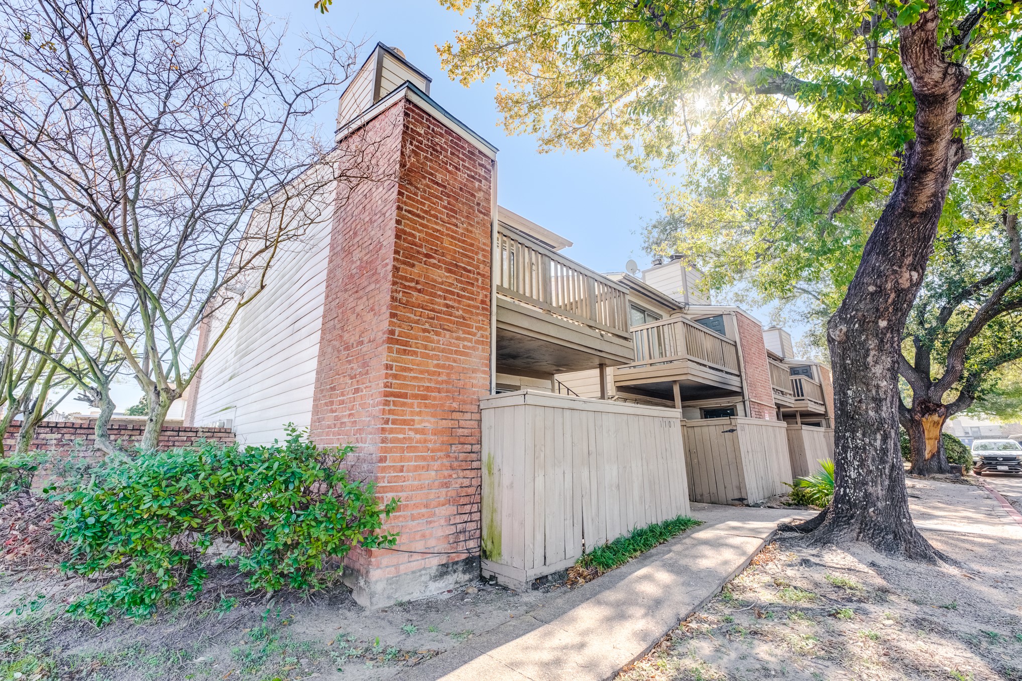6001 Reims Road, Unit 1101 Houston, TX 77036 - Photo 2 of 35 a view of a house with a yard and sitting area