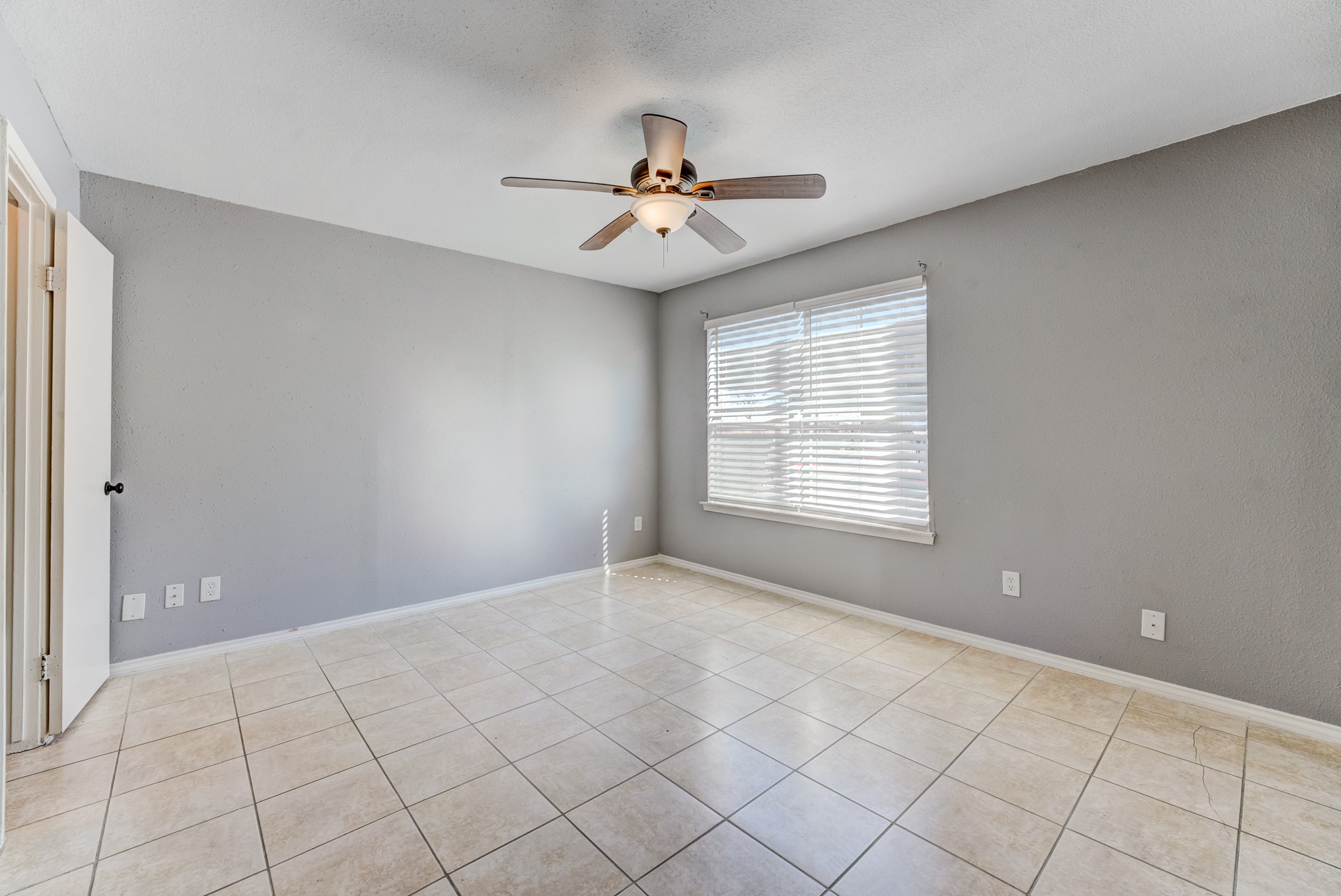 6001 Reims Road, Unit 1101 Houston, TX 77036 - Photo 25 of 35 a view of an empty room with a window