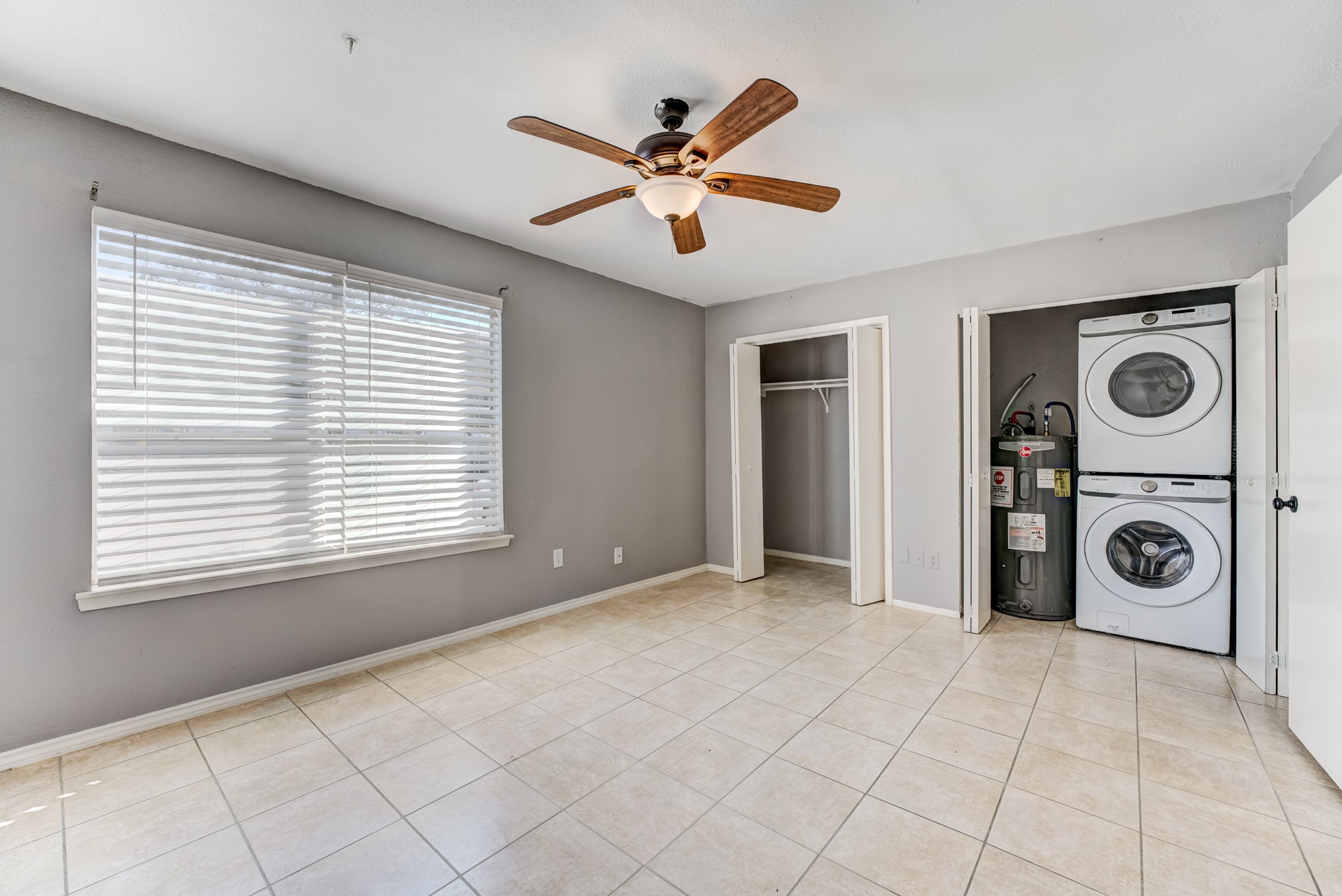 6001 Reims Road, Unit 1101 Houston, TX 77036 - Photo 26 of 35 a view of a livingroom with a ceiling fan and window