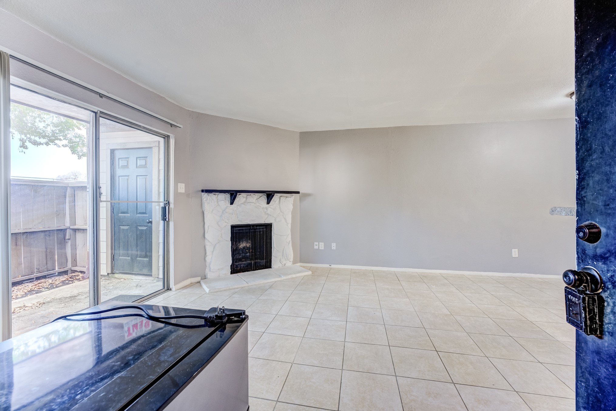 6001 Reims Road, Unit 1101 Houston, TX 77036 - Photo 10 of 35 a view of a livingroom with a fireplace