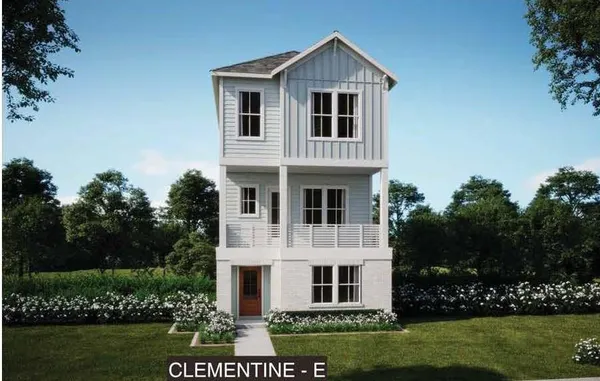 a large white house with a yard and garden