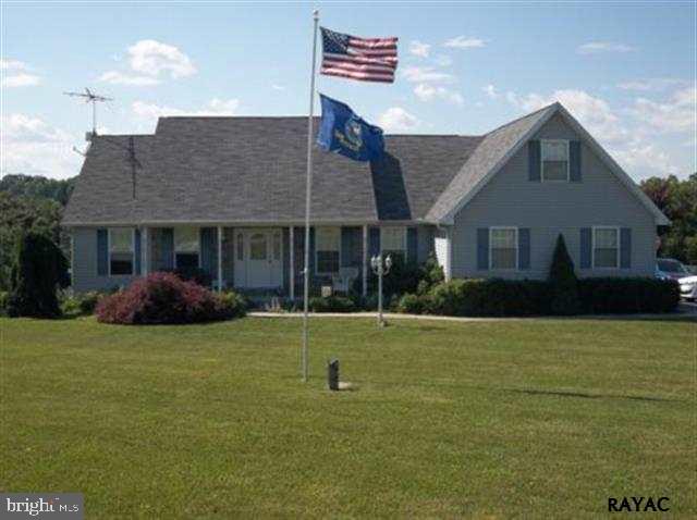 3008 Bowser Road New Freedom, PA 17349 - Photo 1 of 36 a view of a house with a backyard
